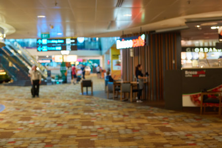 SINGAPORE - CIRCA SEPTEMBER, 2016: defocused shot inside Singapore Changi Airport. Changi Airport is one of the largest transportation hubs in Southeast Asia.のeditorial素材