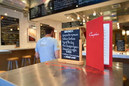 HONG KONG - OCTOBER 25, 2015: menu on a table at cafe in Kennedy Town. Kennedy Town is at the...