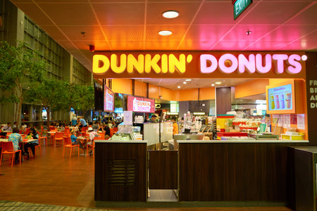 SINGAPORE - CIRCA AUGUST, 2016: Dunkin Donuts at Singapore Changi Airport. Changi Airport is one of the largest transportation hubs in Southeast Asia.のeditorial素材