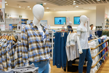SINGAPORE - CIRCA SEPTEMBER, 2016: inside Uni Qlo store at Singapore Changi Airport. Uniqlo Co., Ltd. is a Japanese casual wear designer, manufacturer and retailer.のeditorial素材