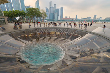 SINGAPORE - CIRCA NOVEMBER, 2015: water at  Rain Oculus falling through the atrium. Rain Oculus is a large whirlpool forms inside a 70 foot diameter acrylic bowl and falls 2 stories to a pool belowのeditorial素材