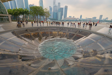 SINGAPORE - CIRCA NOVEMBER, 2015: water at  Rain Oculus falling through the atrium. Rain Oculus is a...