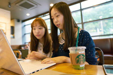 SEOUL, SOUTH KOREA - CIRCA MAY, 2017: people at Starbucks in Seoul. Starbucks Corporation is an American coffee company and coffeehouse chain.のeditorial素材