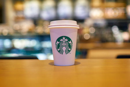 SEOUL, SOUTH KOREA - CIRCA JUNE, 2017: close up shot of Starbucks coffee take away cup. Starbucks Corporation is an American coffee company and coffeehouse chain.のeditorial素材
