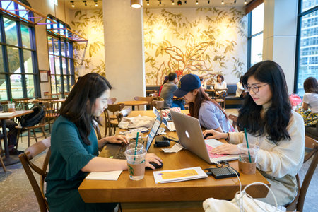 SEOUL, SOUTH KOREA - CIRCA JUNE, 2017: people at Starbucks in Seoul. Starbucks Corporation is an American coffee company and coffeehouse chain.のeditorial素材