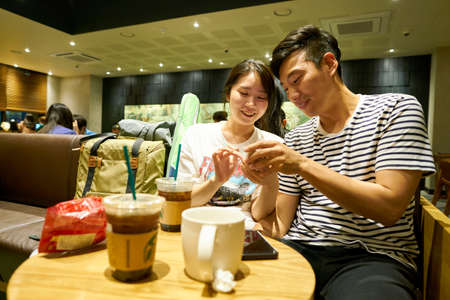 SEOUL, SOUTH KOREA - CIRCA MAY, 2017: people at Starbucks in Seoul. Starbucks Corporation is an American coffee company and coffeehouse chain.のeditorial素材