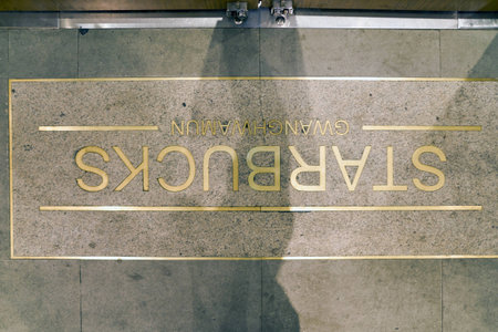SEOUL, SOUTH KOREA - CIRCA JUNE, 2017: sign at a Starbucks in Seoul. Starbucks Corporation is an American coffee company and coffeehouse chain.のeditorial素材