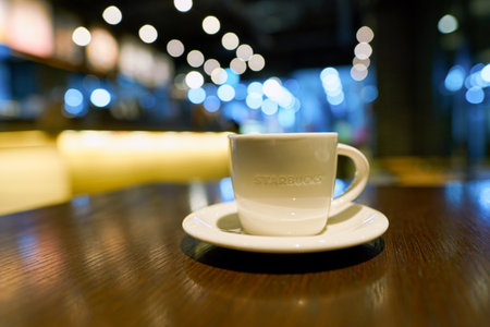 SEOUL, SOUTH KOREA - CIRCA MAY, 2017: a cup of coffee on a table in Starbucks. Starbucks Corporation is an American coffee company and coffeehouse chain.のeditorial素材