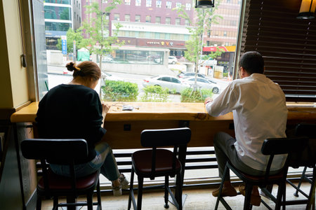 SEOUL, SOUTH KOREA - CIRCA MAY, 2017: people at Starbucks in Seoul. Starbucks Corporation is an American coffee company and coffeehouse chain.のeditorial素材