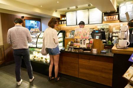 SEOUL, SOUTH KOREA - CIRCA MAY, 2017: people at Starbucks in Seoul. Starbucks Corporation is an...