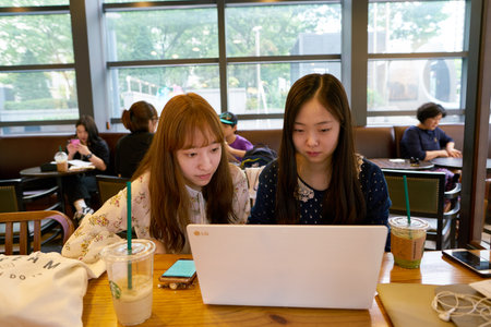SEOUL, SOUTH KOREA - CIRCA MAY, 2017: people at Starbucks in Seoul. Starbucks Corporation is an American coffee company and coffeehouse chain.のeditorial素材