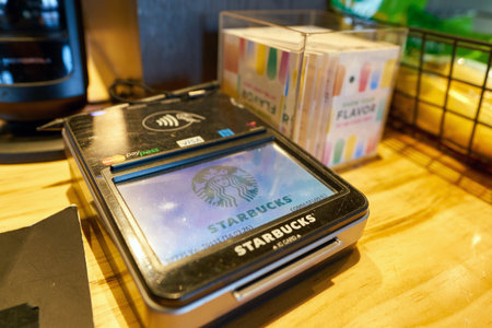 SEOUL, SOUTH KOREA - CIRCA MAY, 2017: a payment terminal at Starbucks coffee shop in Seoul. Starbucks Corporation is an American coffee company and coffeehouse chain.のeditorial素材