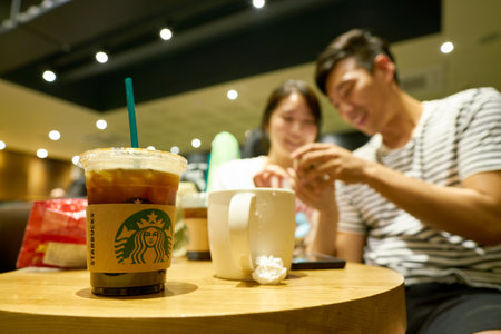 SEOUL, SOUTH KOREA - CIRCA MAY, 2017: close up shot of a cup Starbucks in Seoul. Starbucks Corporation is an American coffee company and coffeehouse chain.のeditorial素材