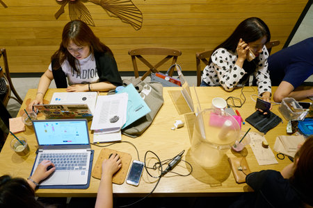 SEOUL, SOUTH KOREA - CIRCA MAY, 2017: people at Starbucks in Seoul. Starbucks Corporation is an American coffee company and coffeehouse chain.のeditorial素材