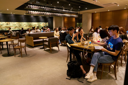 SEOUL, SOUTH KOREA - CIRCA MAY, 2017: inside Starbucks in Seoul. Starbucks Corporation is an American coffee company and coffeehouse chain.のeditorial素材
