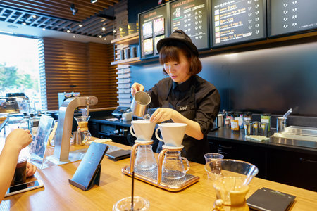 SEOUL, SOUTH KOREA - CIRCA MAY, 2017: worker at Starbucks Reserve. Starbucks Corporation is an American coffee company and coffeehouse chain.のeditorial素材
