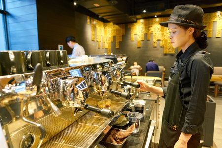 SEOUL, SOUTH KOREA - CIRCA MAY, 2017: worker at Starbucks Reserve. Starbucks Corporation is an American coffee company and coffeehouse chain.のeditorial素材