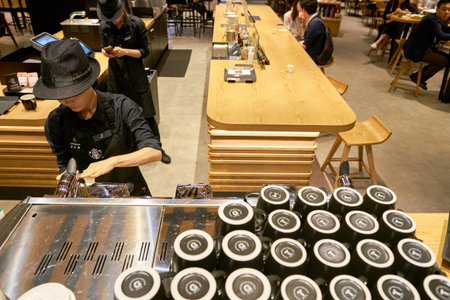 SEOUL, SOUTH KOREA - CIRCA MAY, 2017: worker at Starbucks Reserve. Starbucks Corporation is an American coffee company and coffeehouse chain.のeditorial素材