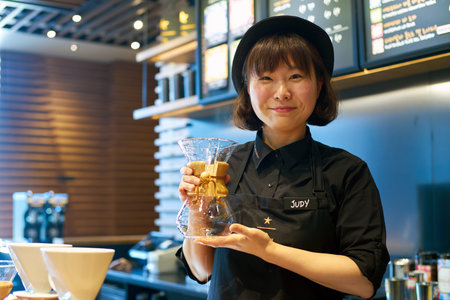 SEOUL, SOUTH KOREA - CIRCA MAY, 2017: indoor portrait of a worker at Starbucks Reserve. Starbucks Corporation is an American coffee company and coffeehouse chain.のeditorial素材