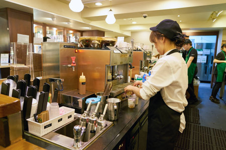 SEOUL, SOUTH KOREA - CIRCA MAY, 2017: worker at Starbucks. Starbucks Corporation is an American coffee company and coffeehouse chain.のeditorial素材