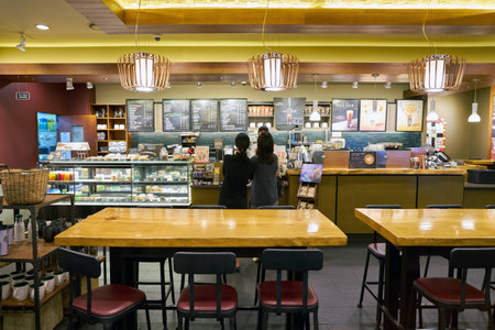 SEOUL, SOUTH KOREA - CIRCA MAY, 2017: inside Starbucks in Seoul. Starbucks Corporation is an American coffee company and coffeehouse chain.のeditorial素材