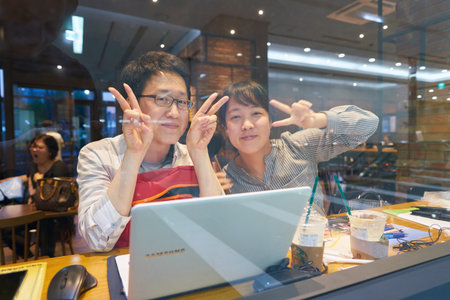 SEOUL, SOUTH KOREA - CIRCA MAY, 2017: people at Starbucks in Seoul. Starbucks Corporation is an American coffee company and coffeehouse chain.のeditorial素材