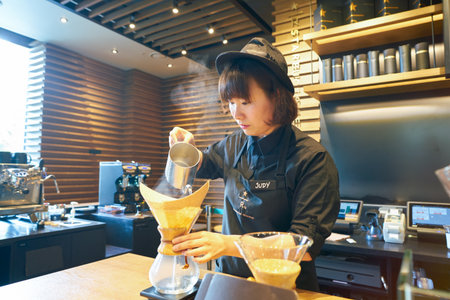 SEOUL, SOUTH KOREA - CIRCA MAY, 2017: worker at Starbucks Reserve. Starbucks Corporation is an American coffee company and coffeehouse chain.のeditorial素材