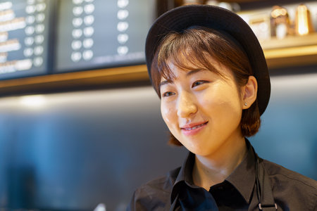 SEOUL, SOUTH KOREA - CIRCA MAY, 2017: indoor portrait of a worker at Starbucks Reserve. Starbucks Corporation is an American coffee company and coffeehouse chain.のeditorial素材