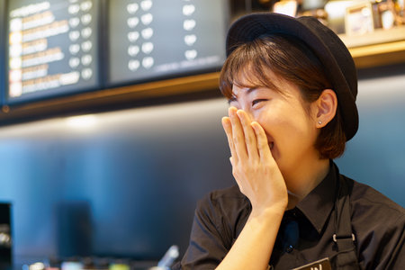 SEOUL, SOUTH KOREA - CIRCA MAY, 2017: indoor portrait of a worker at Starbucks Reserve. Starbucks Corporation is an American coffee company and coffeehouse chain.のeditorial素材