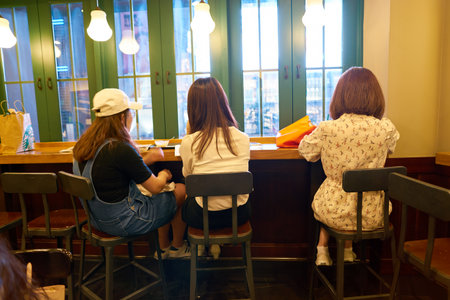 SEOUL, SOUTH KOREA - CIRCA MAY, 2017: people at Starbucks in Seoul. Starbucks Corporation is an American coffee company and coffeehouse chain.のeditorial素材