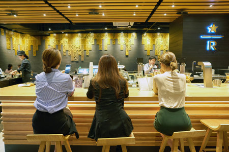 SEOUL, SOUTH KOREA - CIRCA MAY, 2017: people at Starbucks in Seoul. Starbucks Corporation is an American coffee company and coffeehouse chain.のeditorial素材