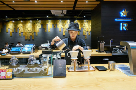 SEOUL, SOUTH KOREA - CIRCA MAY, 2017: worker at Starbucks Reserve. Starbucks Corporation is an American coffee company and coffeehouse chain.のeditorial素材