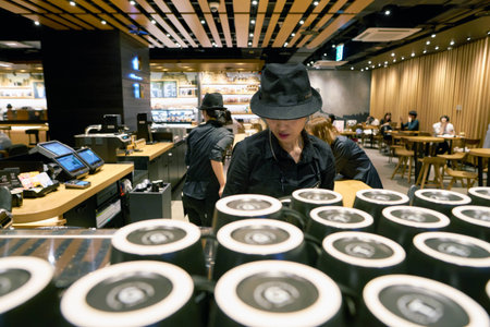 SEOUL, SOUTH KOREA - CIRCA MAY, 2017: worker at Starbucks Reserve. Starbucks Corporation is an American coffee company and coffeehouse chain.のeditorial素材