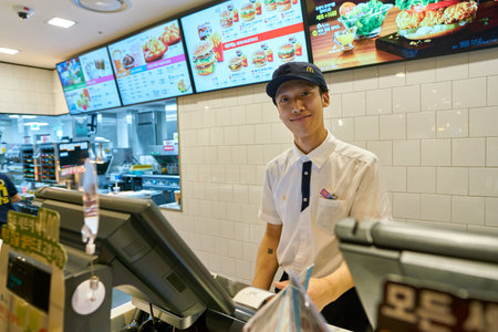 SEOUL, SOUTH KOREA - CIRCA MAY, 2017: indoor portrait of worker at McDonald's restaurant. McDonald's...