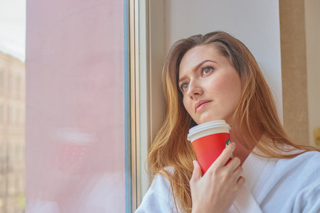 SAINT PETERSBURG, RUSSIA - CIRCA APRIL, 2017: woman with cup of coffee from Starbucksのeditorial素材
