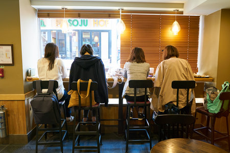 SEOUL, SOUTH KOREA -  CIRCA MAY, 2017: people at Starbucks coffee shop in Seoul. Starbucks Corporation is an American coffee company and coffeehouse chain.のeditorial素材