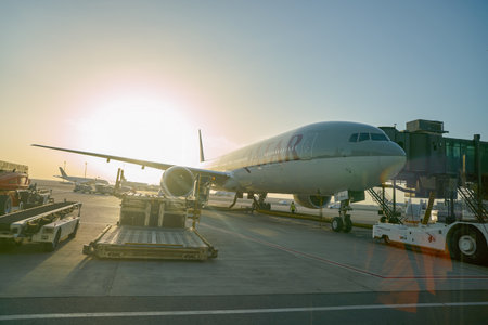 DOHA, QATAR - CIRCA JUNE, 2017: Qatar Airways aircraft on tarmac at Hamad International Airport in the morning.のeditorial素材