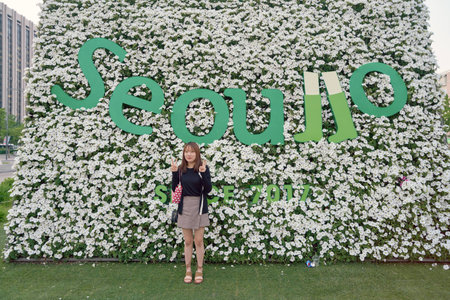 SEOUL, SOUTH KOREA -  MAY 21, 2017: woman posing for taking photo at Seoul 7017 Skypark sign. The Seoullo 7017 Skypark, is an elevated linear park in central Seoul  which opened on May 20, 2017.のeditorial素材