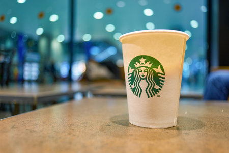 SAINT PETERSBURG, RUSSIA - SEPTEMBER 01, 2014: close up shot of a cup on a table at Starbucks coffee shop.のeditorial素材