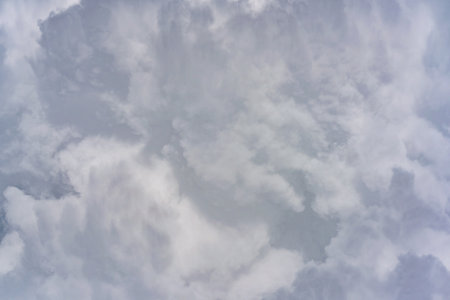 Aerial view of blue sky with clouds from jet flight