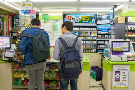 SEOUL, SOUTH KOREA - CIRCA MAY, 2017: men at a CU convenience store. CU is a convenience store...