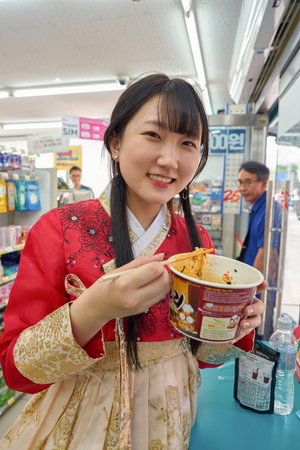 SEOUL, SOUTH KOREA - CIRCA MAY, 2017: woman at GS25 convenience store in Seoul. GS25 is a convenience store brand in South Korea.のeditorial素材