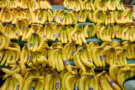 SEOUL, SOUTH KOREA - CIRCA MAY, 2017: bananas on display at Lotte Mart in Seoul. Lotte Mart is an east Asian hypermarket that sells a variety of groceries, clothing, toys, electronics, and other goods.のeditorial素材