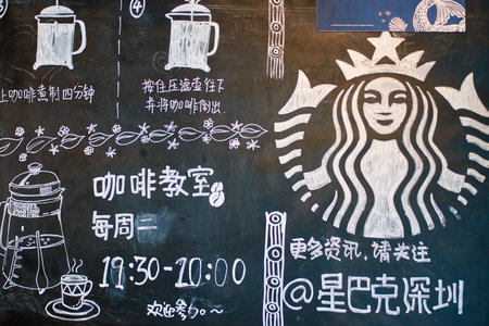 SHENZHEN, CHINA - CIRCA OCTOBER, 2015: close up shot of blackboard at Starbucks coffee shop in Shenzhen. Starbucks Corporation is an American coffee company and coffeehouse chain.のeditorial素材