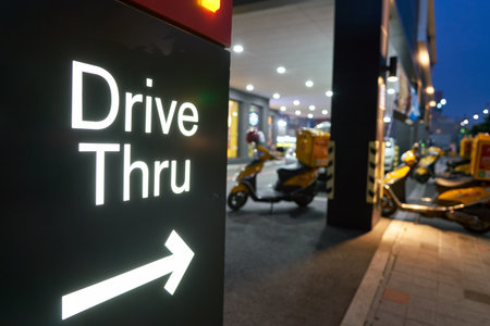 BUSAN, SOUTH KOREA - CIRCA MAY, 2017: Drive Thru sign at McDonald's. A drive-thru is a type of service provided by a business that allows customers to purchase products without leaving their cars.のeditorial素材