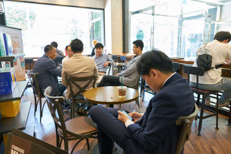 BUSAN, SOUTH KOREA - CIRCA MAY, 2017: inside Starbucks coffee shop in Busan. Starbucks Corporation is an American coffee company and coffeehouse chain.のeditorial素材
