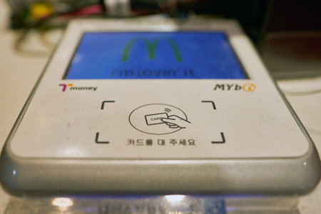 BUSAN, SOUTH KOREA - CIRCA MAY, 2017: wireless payment terminal at McDonald's restaurant. McDonald's...