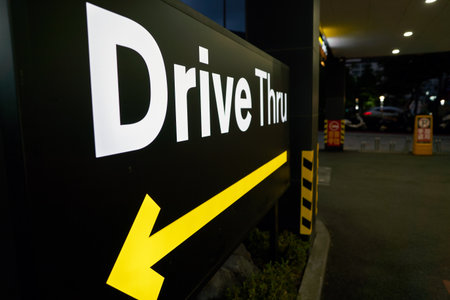 BUSAN, SOUTH KOREA - CIRCA MAY, 2017: Drive Thru sign at McDonald's. A drive-thru is a type of service provided by a business that allows customers to purchase products without leaving their cars.のeditorial素材