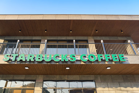 BUSAN, SOUTH KOREA - CIRCA MAY, 2017: Starbucks coffee shop in Busan. Starbucks Corporation is an American coffee company and coffeehouse chain.のeditorial素材