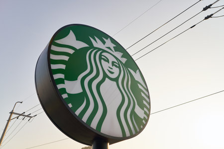 BUSAN, SOUTH KOREA - CIRCA MAY, 2017: Starbucks sign at coffee shop in Busan. Starbucks Corporation is an American coffee company and coffeehouse chain.のeditorial素材